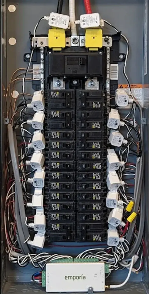 Emporia energy monitor with sensors installed on residential electrical panel